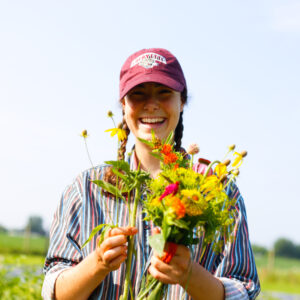 Lafarm student worker Addie King ’21 pick flowers for the on-campus market